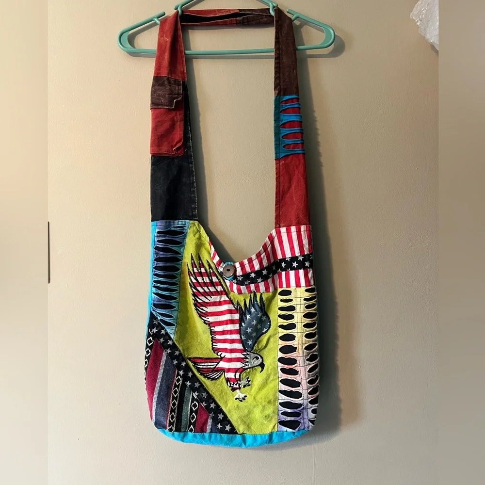 Rising International Americana Eagle bag with button and zip closure crossbody.